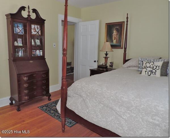 110 E Blalock Rd, Lucama, NC 27851 - bedroom with wood finished floors and baseboards