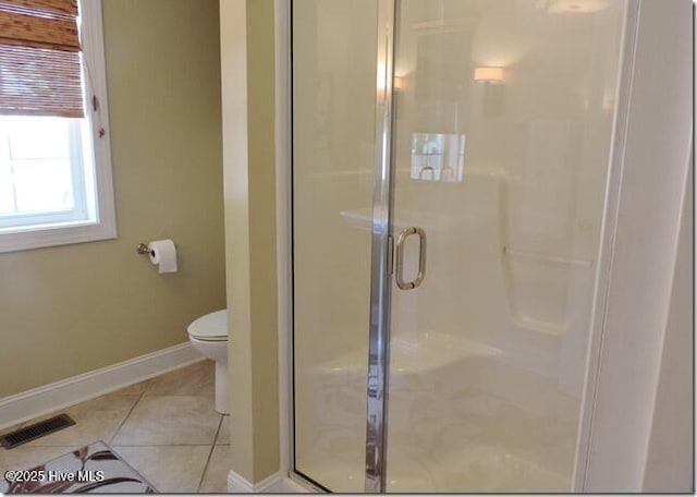 110 E Blalock Rd, Lucama, NC 27851 - bathroom with a shower stall, toilet, tile patterned floors, and baseboards