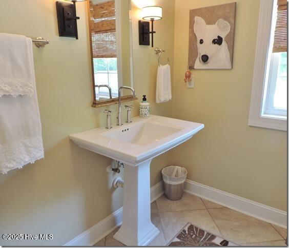110 E Blalock Rd, Lucama, NC 27851 - bathroom featuring tile patterned flooring and baseboards