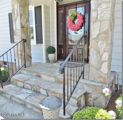 110 E Blalock Rd, Lucama, NC 27851 - doorway to property featuring stone siding