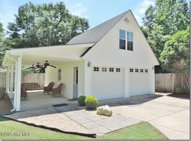 110 E Blalock Rd, Lucama, NC 27851 - garage featuring a ceiling fan and concrete driveway