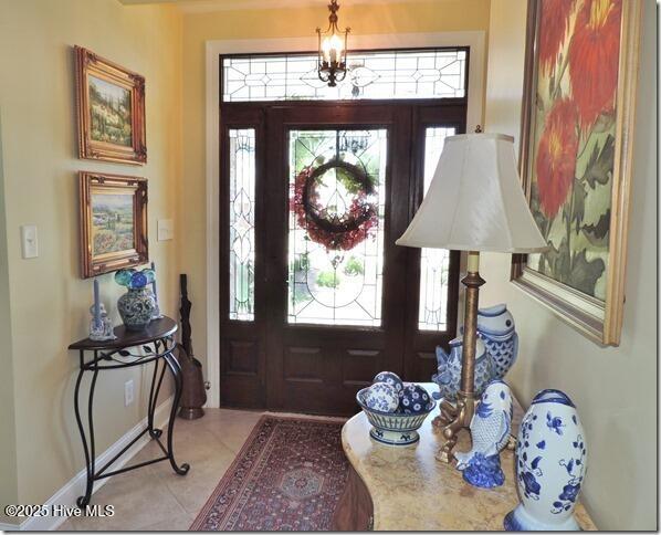 110 E Blalock Rd, Lucama, NC 27851 - entryway featuring light tile patterned flooring, plenty of natural light, and baseboards