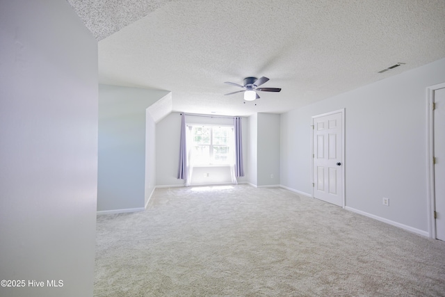 159 Dockside Dr, Jacksonville, NC 28546 - unfurnished living room with ceiling fan, a textured ceiling, carpet flooring, and baseboards