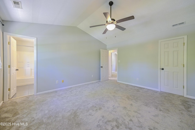 159 Dockside Dr, Jacksonville, NC 28546 - unfurnished bedroom with carpet floors, lofted ceiling, baseboards, ensuite bathroom, and a ceiling fan