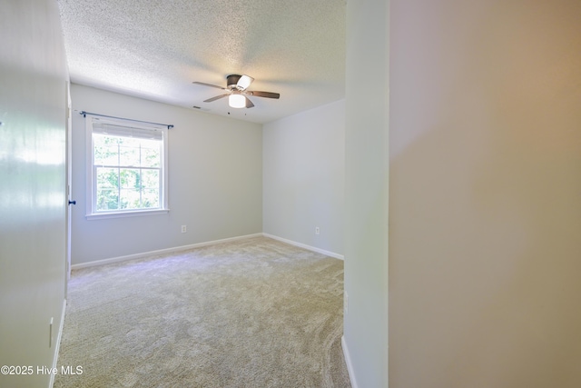 159 Dockside Dr, Jacksonville, NC 28546 - spare room featuring ceiling fan, a textured ceiling, carpet floors, and baseboards