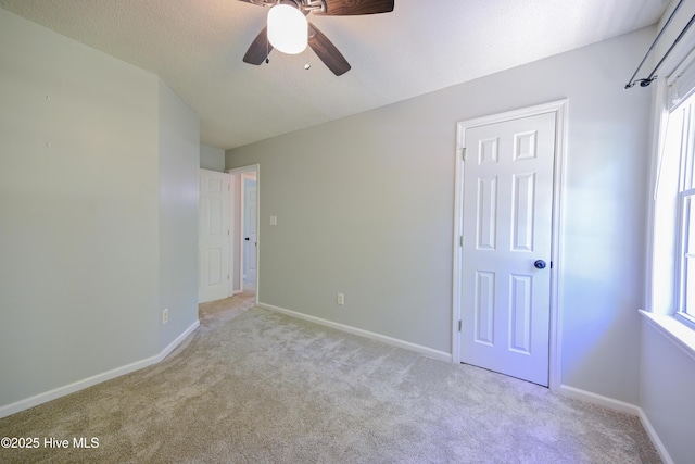 159 Dockside Dr, Jacksonville, NC 28546 - unfurnished bedroom featuring light carpet, baseboards, and a ceiling fan