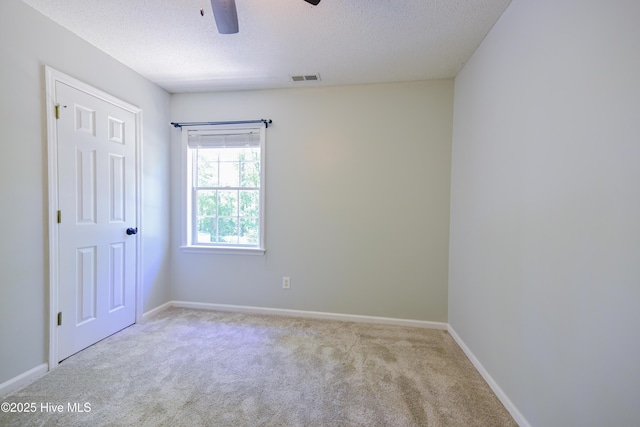 159 Dockside Dr, Jacksonville, NC 28546 - spare room featuring carpet, a ceiling fan, a textured ceiling, and baseboards