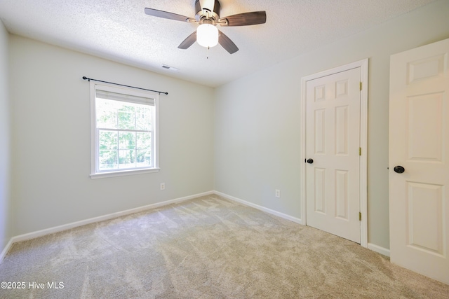 159 Dockside Dr, Jacksonville, NC 28546 - unfurnished room featuring carpet flooring, a textured ceiling, a ceiling fan, and baseboards