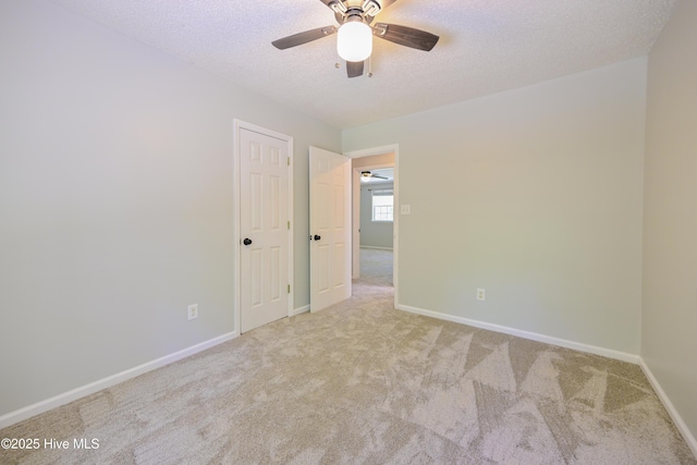 159 Dockside Dr, Jacksonville, NC 28546 - carpeted empty room featuring a textured ceiling, ceiling fan, and baseboards