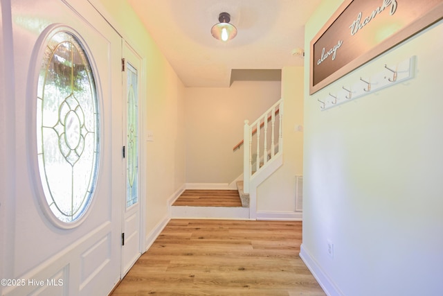 159 Dockside Dr, Jacksonville, NC 28546 - foyer with stairway, light wood-style floors, and baseboards