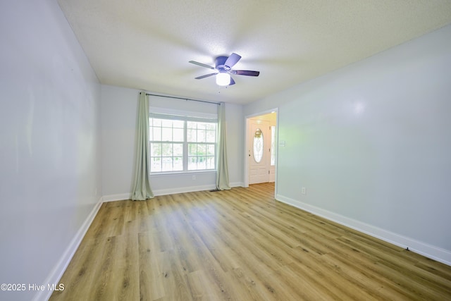 159 Dockside Dr, Jacksonville, NC 28546 - spare room featuring a ceiling fan, light wood-style flooring, baseboards, and a textured ceiling
