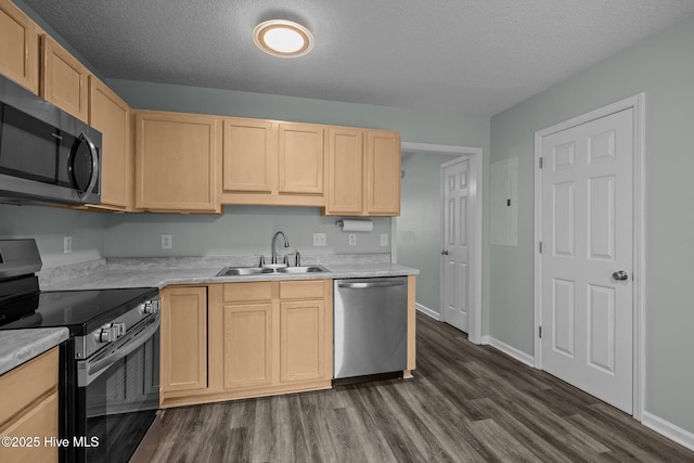 202 Courtyard W, Newport, NC 28570 - kitchen featuring stainless steel dishwasher, range with electric cooktop, light brown cabinetry, dark wood finished floors, and a textured ceiling