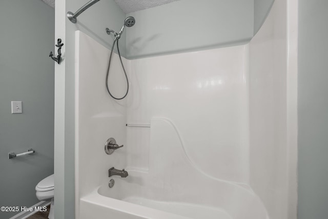 202 Courtyard W, Newport, NC 28570 - bathroom with bathtub / shower combination and a textured ceiling