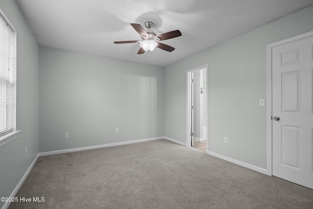 202 Courtyard W, Newport, NC 28570 - spare room with ceiling fan, carpet floors, and a textured ceiling