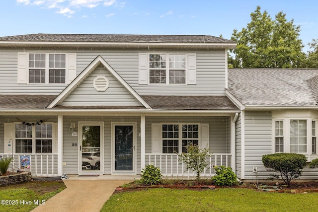 202 Courtyard W, Newport, NC 28570 - view of front of home featuring a porch and a shingled roof