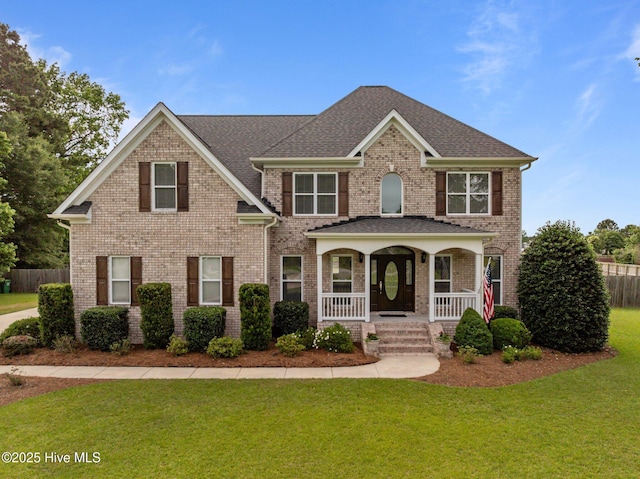 3107 Indian Wells Pl, Greenville, NC 27858 - view of front of property featuring a porch, brick siding, and a shingled roof