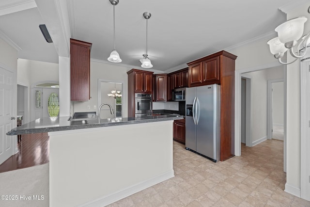3107 Indian Wells Pl, Greenville, NC 27858 - kitchen with stainless steel appliances, a chandelier, dark countertops, a peninsula, and crown molding