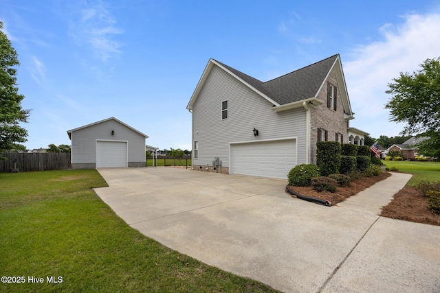 3107 Indian Wells Pl, Greenville, NC 27858 - view of side of property with an attached garage, an outdoor structure, and a shingled roof