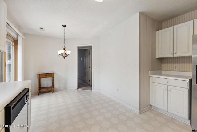 6814 Lipscomb Dr, Wilmington, NC 28412 - unfurnished dining area with a chandelier, light flooring, and baseboards