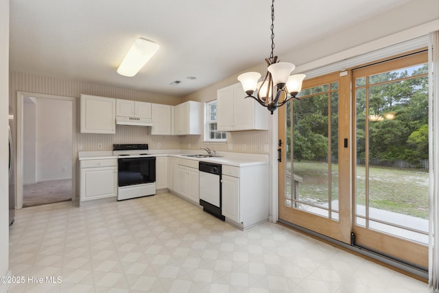 6814 Lipscomb Dr, Wilmington, NC 28412 - kitchen featuring white appliances, under cabinet range hood, light flooring, a sink, and light countertops