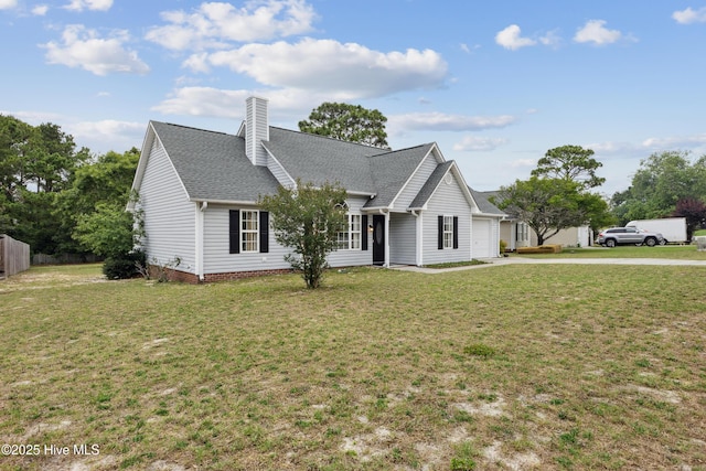 6814 Lipscomb Dr, Wilmington, NC 28412 - view of front of house with an attached garage, driveway, roof with shingles, and a chimney