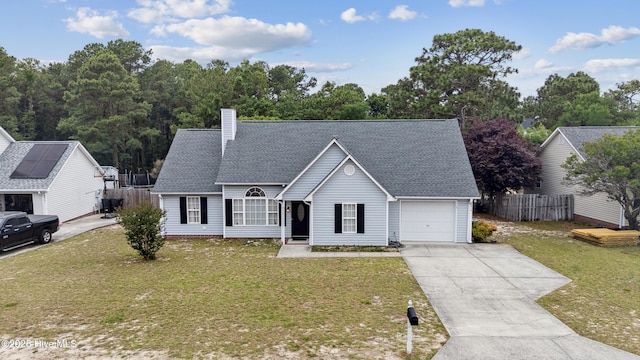 6814 Lipscomb Dr, Wilmington, NC 28412 - view of front of house with a garage, roof with shingles, driveway, and a chimney