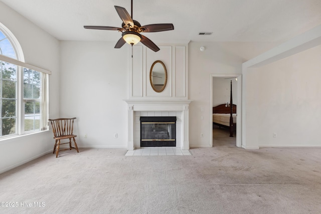 6814 Lipscomb Dr, Wilmington, NC 28412 - unfurnished living room featuring healthy amount of natural light, a fireplace, carpet flooring, and ceiling fan
