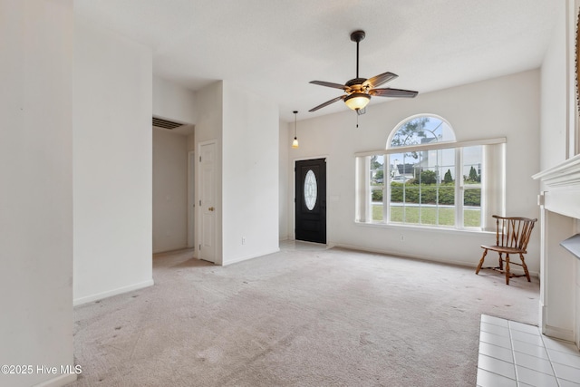 6814 Lipscomb Dr, Wilmington, NC 28412 - unfurnished living room featuring carpet floors, ceiling fan, and baseboards