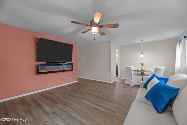 210 Glenburnie Dr, New Bern, NC 28560 - living room with wood finished floors, a ceiling fan, healthy amount of natural light, and baseboards