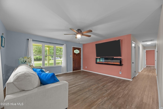 210 Glenburnie Dr, New Bern, NC 28560 - living room featuring wood finished floors, a ceiling fan, and baseboards