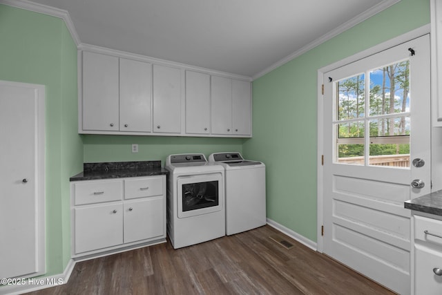 210 Glenburnie Dr, New Bern, NC 28560 - laundry room with cabinet space, washing machine and dryer, dark wood finished floors, crown molding, and baseboards