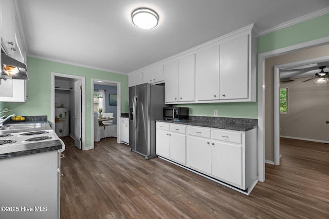 210 Glenburnie Dr, New Bern, NC 28560 - kitchen featuring stainless steel fridge, black microwave, wall chimney exhaust hood, white cabinets, and dark wood-type flooring