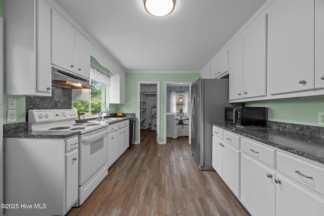 210 Glenburnie Dr, New Bern, NC 28560 - kitchen featuring white electric range oven, under cabinet range hood, black microwave, dark countertops, and a sink