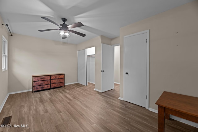210 Glenburnie Dr, New Bern, NC 28560 - unfurnished bedroom featuring wood finished floors, baseboards, and a ceiling fan