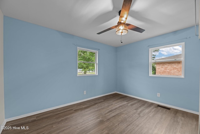 210 Glenburnie Dr, New Bern, NC 28560 - spare room featuring wood finished floors, baseboards, and a ceiling fan