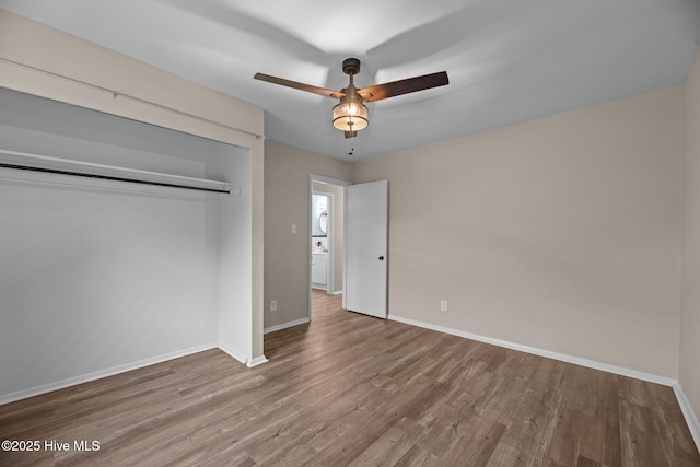 210 Glenburnie Dr, New Bern, NC 28560 - unfurnished bedroom featuring wood finished floors, baseboards, a closet, and a ceiling fan