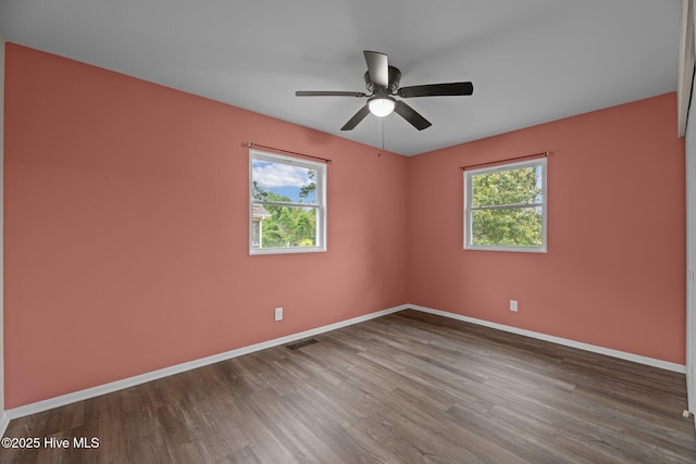 210 Glenburnie Dr, New Bern, NC 28560 - unfurnished room with wood finished floors, baseboards, and ceiling fan