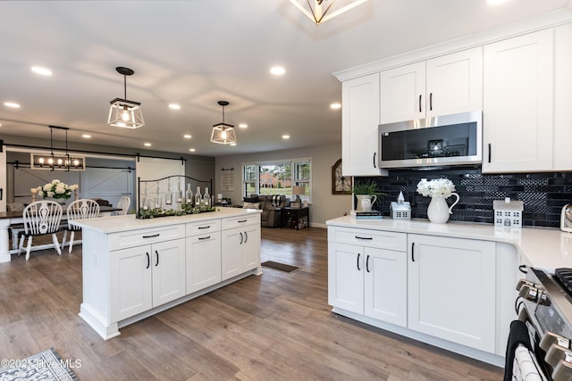 103 Midway Ln, Roanoke Rapids, NC 27870 - kitchen with stainless steel appliances, recessed lighting, light countertops, decorative backsplash, and pendant lighting
