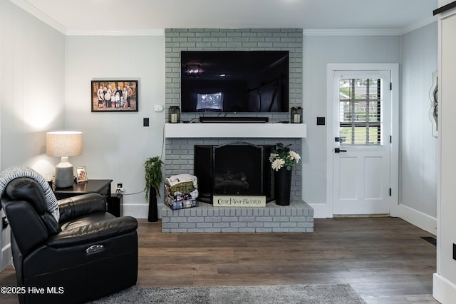 103 Midway Ln, Roanoke Rapids, NC 27870 - living room with a brick fireplace, crown molding, wood finished floors, and baseboards