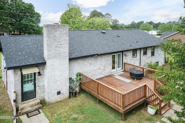 103 Midway Ln, Roanoke Rapids, NC 27870 - rear view of house featuring a shingled roof, brick siding, and a wooden deck