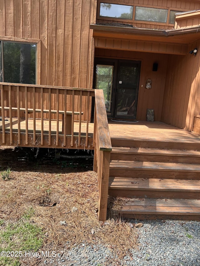 106 Eagle Ln, Hampstead, NC 28443 - view of exterior entry with a wooden deck