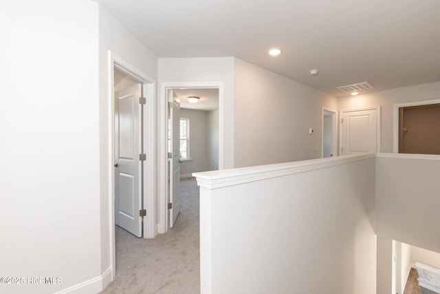 2986 Lyndhurst Ter SW, Shallotte, NC 28470 - corridor with light colored carpet, an upstairs landing, baseboards, and recessed lighting