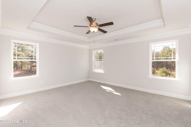 2986 Lyndhurst Ter SW, Shallotte, NC 28470 - carpeted empty room with a tray ceiling, ornamental molding, a ceiling fan, and baseboards