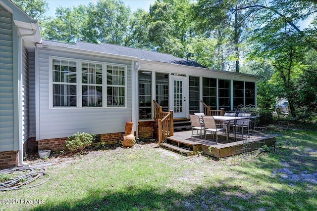 547 Deer Run Rd, New Bern, NC 28562 - rear view of property featuring a sunroom, a wooden deck, a lawn, and french doors