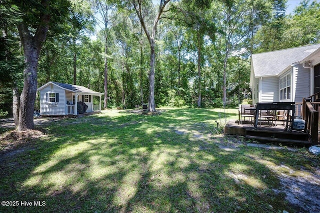 547 Deer Run Rd, New Bern, NC 28562 - view of grassy yard featuring a deck and an outbuilding