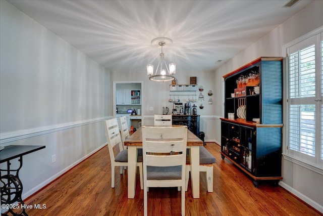 547 Deer Run Rd, New Bern, NC 28562 - dining space featuring a chandelier, wood finished floors, and healthy amount of natural light