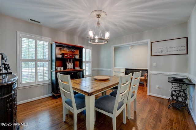 547 Deer Run Rd, New Bern, NC 28562 - dining space featuring a chandelier, wood finished floors, and baseboards