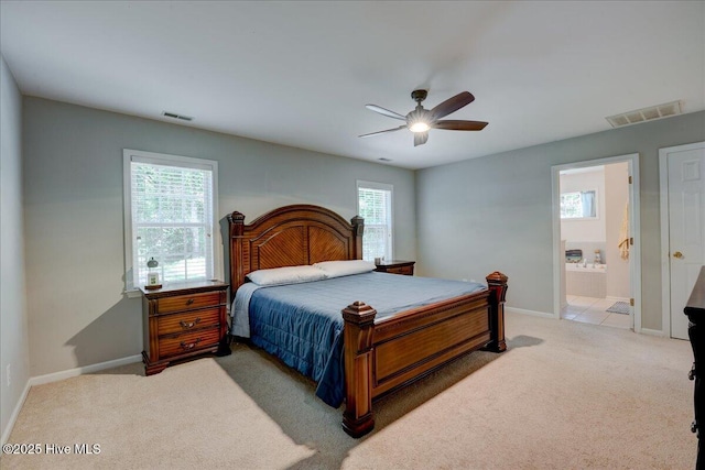 547 Deer Run Rd, New Bern, NC 28562 - carpeted bedroom featuring baseboards, a ceiling fan, and connected bathroom