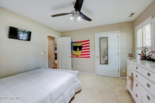 547 Deer Run Rd, New Bern, NC 28562 - bedroom featuring light carpet, baseboards, and a ceiling fan