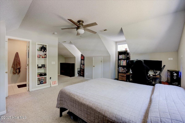 547 Deer Run Rd, New Bern, NC 28562 - bedroom with vaulted ceiling, carpet flooring, a textured ceiling, baseboards, and connected bathroom